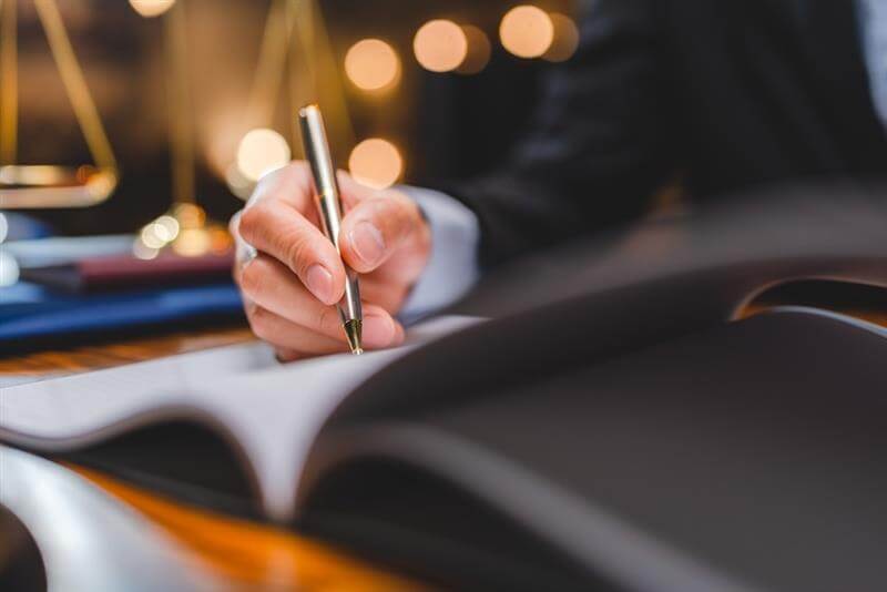 Lawyer writing for personal injury demand letter.