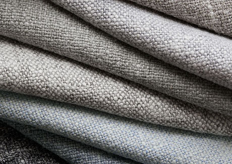 Product shot of fabric for thermal drapes focusing on the thick, absorptive fabrics like wool with natural fibers