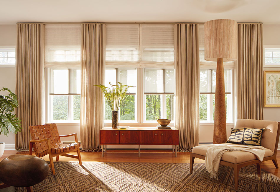 Curtains for living room ideas with layered drapery, Roman shades, and solar shades in a warm wood-toned setting.