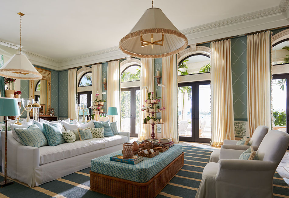 Curtain design ideas for living room spaces featuring Luxe Linen drapes with decorative trim in a elegant room with arched windows.