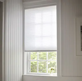 A back room has privacy shades in the Cellular Shade style made of Single Cell light filtering material in Lace as decorative window coverings for privacy