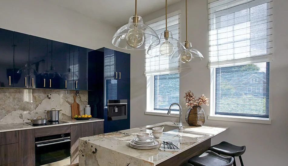 Contemporary window shades in an urban kitchen include flat roman shades with a neutral color and subtle stripe pattern