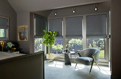 Flat Roman Shades made of Wool Blend in Charcoal block light in a traditional bedroom with blackout lining